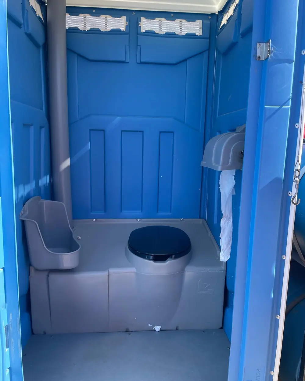 Towable porta potty trailers on a dirt work site